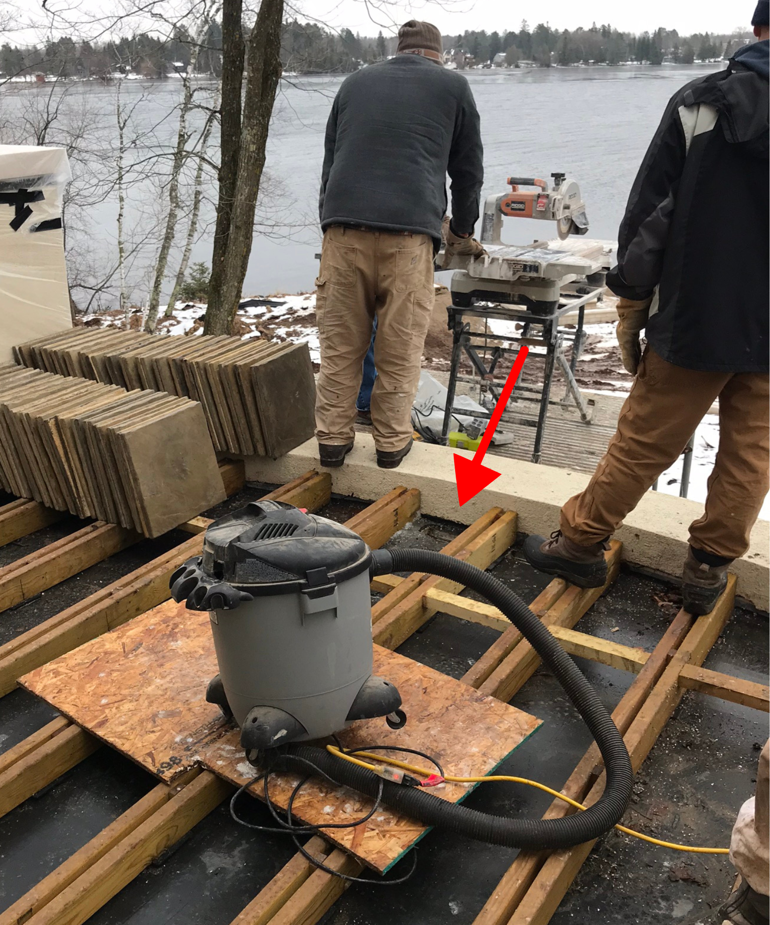 Roof deck parapet wall locking in DekTek's concrete deck tiles