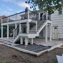 Permeable paver concrete deck tiles patio walk out basement patio installation - flood zone