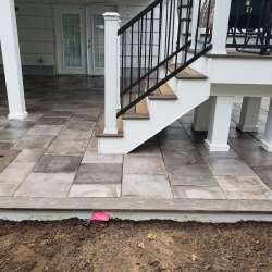 Permeable paver concrete deck tiles patio walk out basement patio installation - flood zone