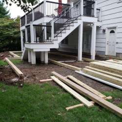 Permeable paver concrete deck tiles patio walk out basement patio installation - flood zone