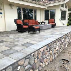 DekTek's luxury concrete deck tiles are locked in on the elevated deck with aluminum edge trim in Pebble Beach California