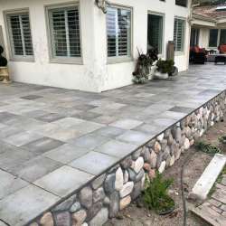 DekTek's luxury concrete deck tiles are locked in on the elevated deck with aluminum edge trim in Pebble Beach California